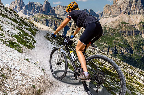 Mountainbiker rides uphill